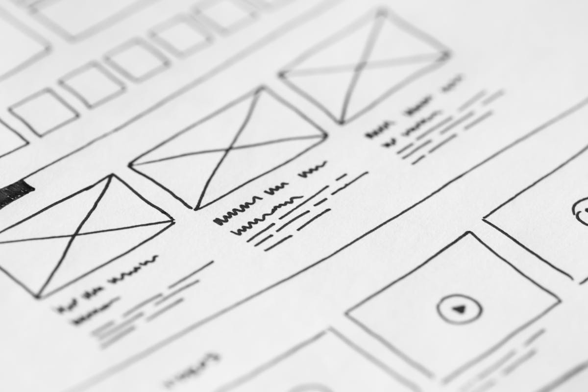 UX designer working on a web page template wireframe with multiple content layers and data fields