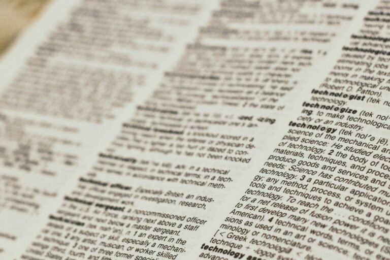 Close-up of a dictionary page showing word definitions, representing the taxonomy of SEO, AEO, GEO, and LLMO terms