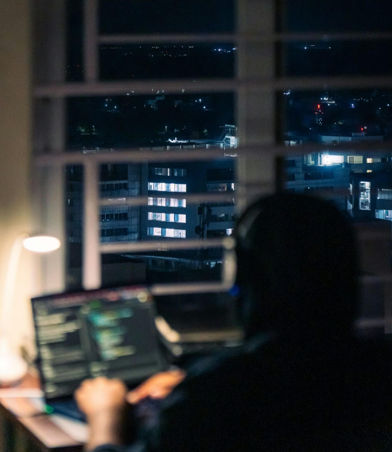 B2B marketer reviewing growth and pipeline data on a laptop at night