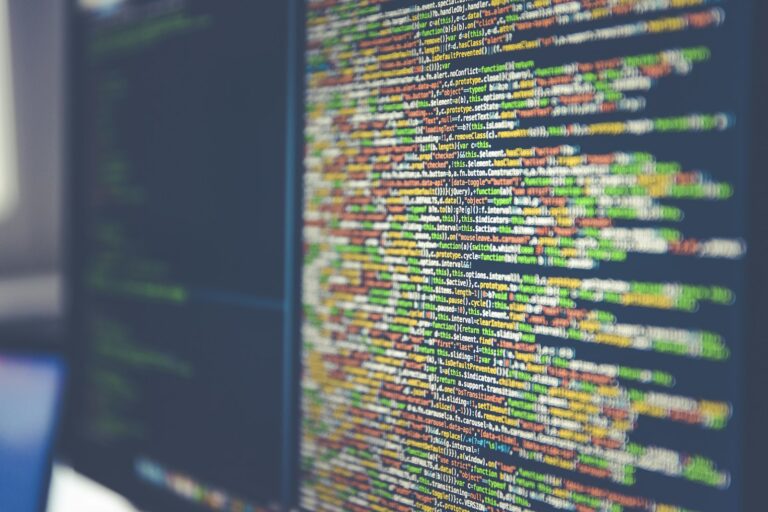 Lines of syntax-highlighted code on a monitor, representing a CLI-driven BigQuery and CRM pipeline investigation